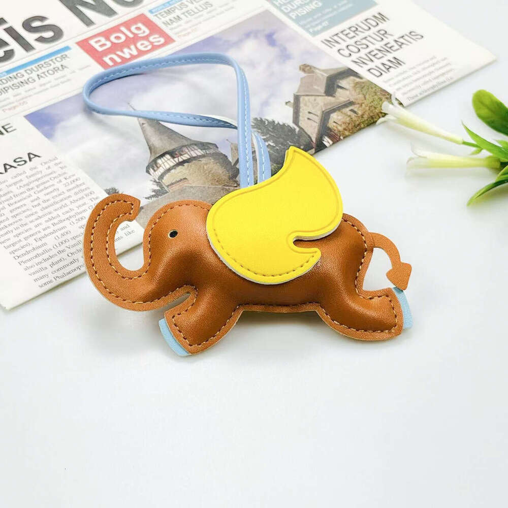 Mascot Leather Creative Backpack Car Keychain 3D Cute Flying Elephant Pendant Candy Color S260126