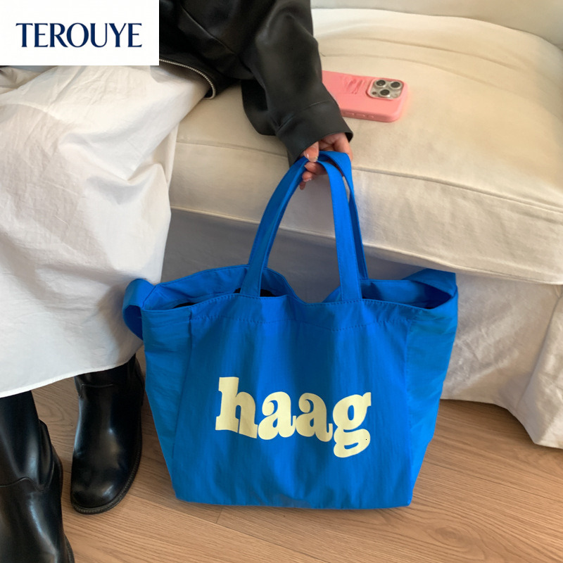 TEROUYE autumn bag and winter new Korean letter simple style niche design fashionable large capacity canvas bag women's shoulder bag