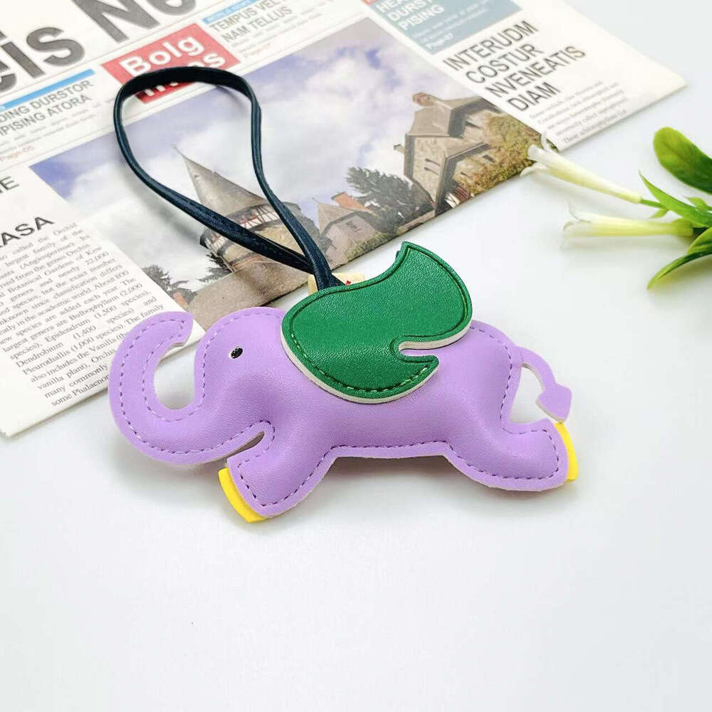 Mascot Leather Creative Backpack Car Keychain 3D Cute Flying Elephant Pendant Candy Color S260126