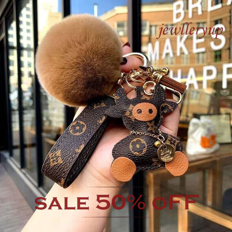 Leather keychain Fur ball pendant bag hanger Can be used as a leather accessory and given as a gift