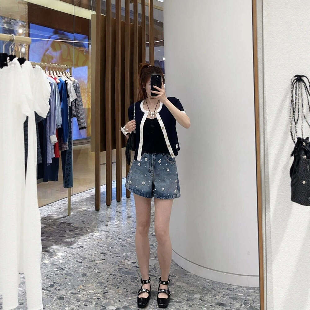 2026 summer new women's clothing color block style metal button decoration slim fit short sleeved knitted cardigan top