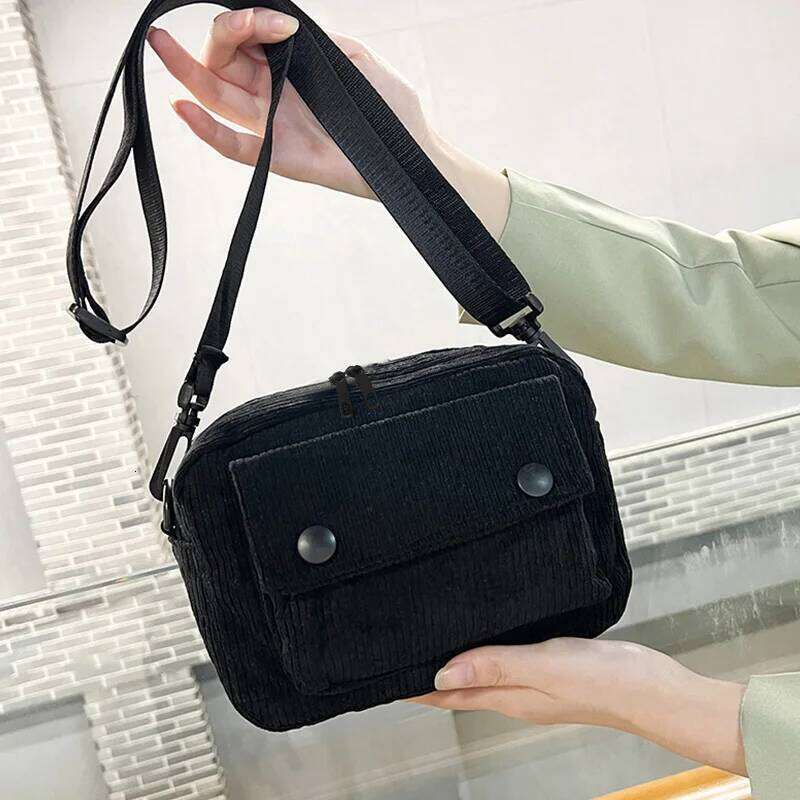 Neutral men's and women's cross-body bag shoulder strap, made of corduroy material, with a flap design on the outside.