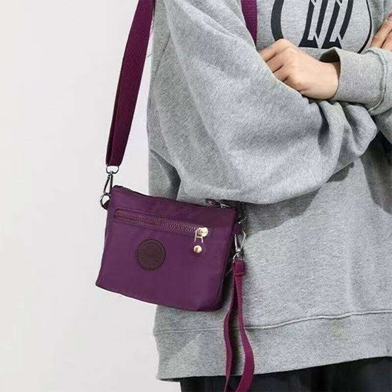 Neutral style men's women's mini shoulder bags in nylon material, suitable for travel and business use. XJ260129