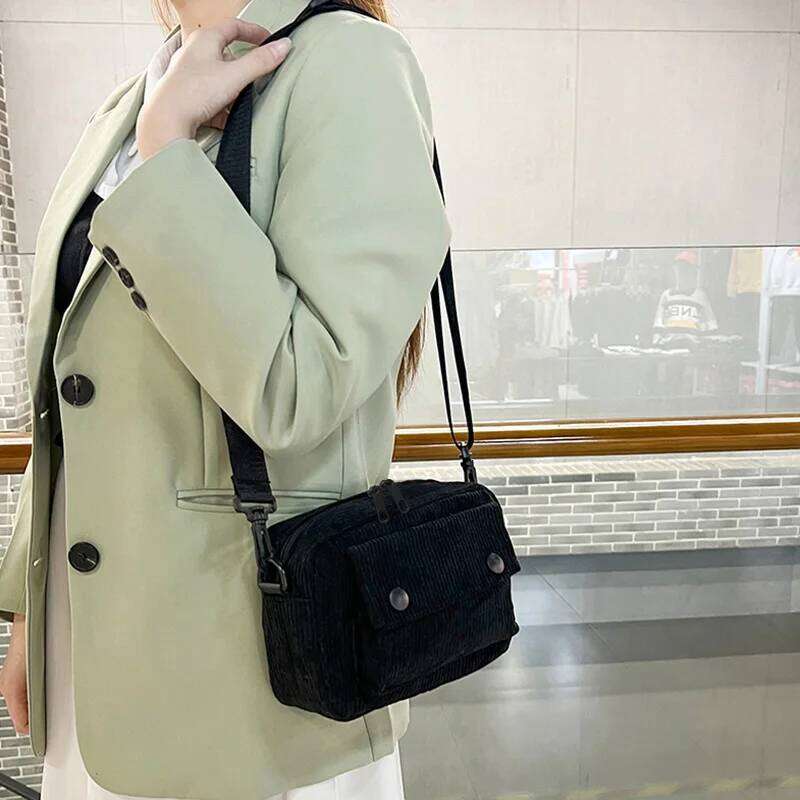 Neutral men's and women's cross-body bag shoulder strap, made of corduroy material, with a flap design on the outside.