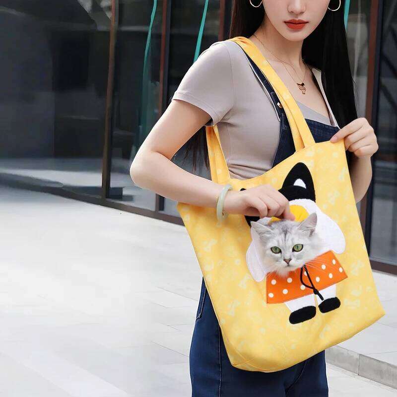 A lightweight handbag suitable for small dogs and cats weighing less than 15 pounds, featuring a padded pet bag style dog 26H0130
