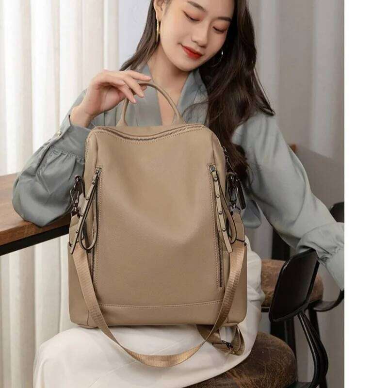 Simple Fashion Backpack Ladies Temperament Hundred Shoulder Soft Leather Solid Color Travel Computer Bag Rivet Decoration