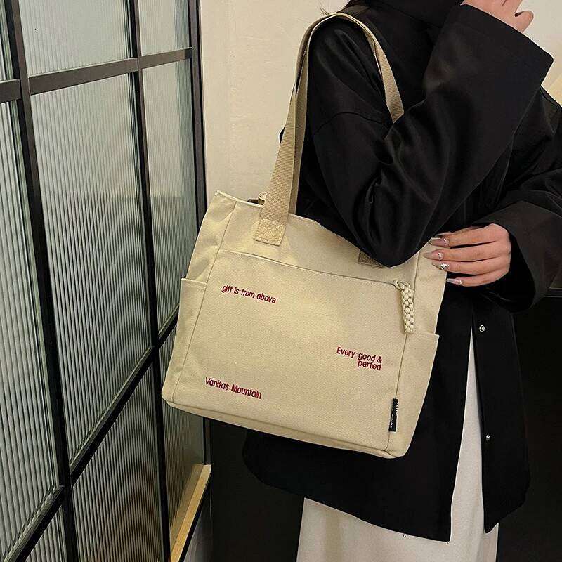 Commuting large capacity single shoulder canvas bag, women's Korean version versatile hand-held tote bag