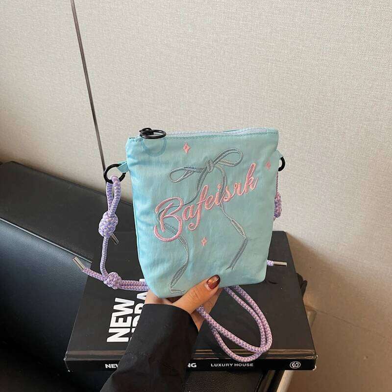Bow embroidered crossbody bag for women, 2025 new ins niche mobile phone coin purse commuting shoulder bag.