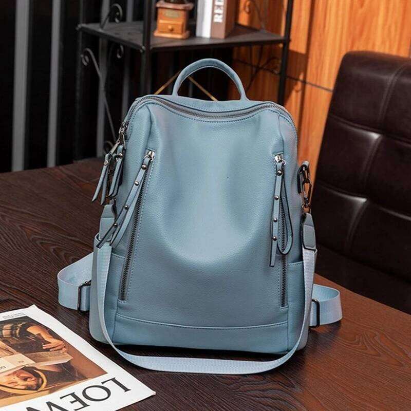 Simple Fashion Backpack Ladies Temperament Hundred Shoulder Soft Leather Solid Color Travel Computer Bag Rivet Decoration