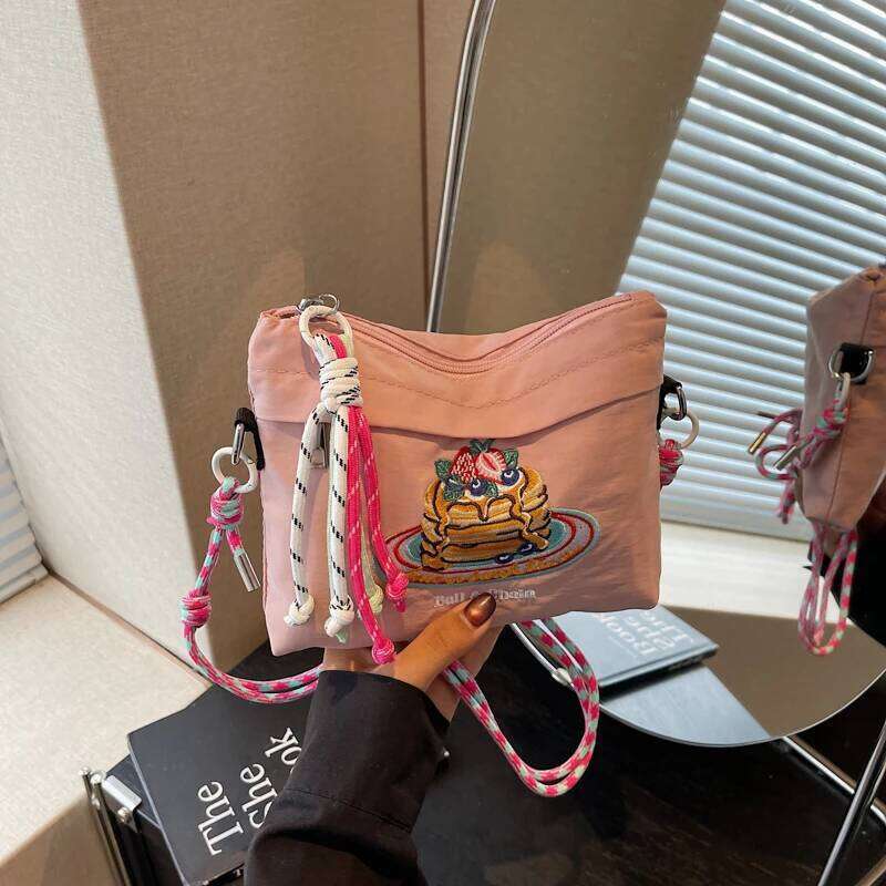 Japanese-style embroidered shoulder bag for women with unique design, large capacity, and a slanted cross-body style, small sq