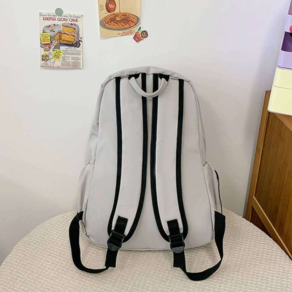 Korean-style large-capacity solid-color backpack girls Korean version, versatile bag for boys high school size, d