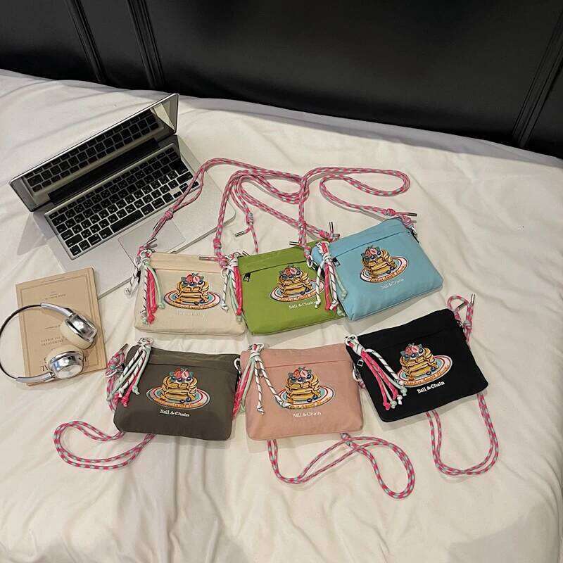 Japanese-style embroidered shoulder bag for women with unique design, large capacity, and a slanted cross-body style, small sq