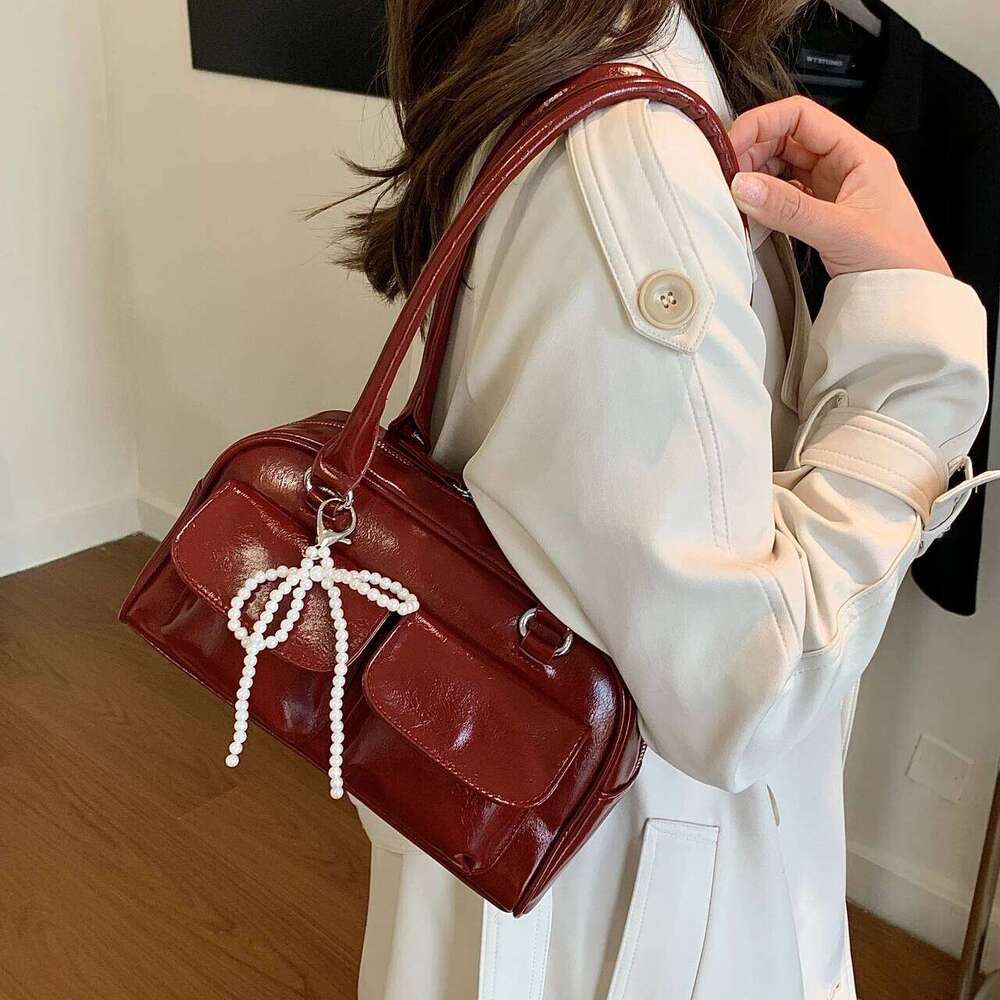 Simple casual bow tie armpit bag ladies, new Korean version for 2024; fashionable and versatile single shoulder bag.