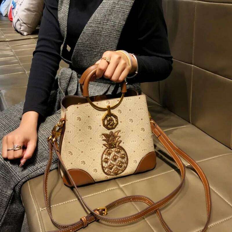 Brand designer handbag retro bucket women's 2025 new autumn and winter high-end printed shoulder crossbody bag