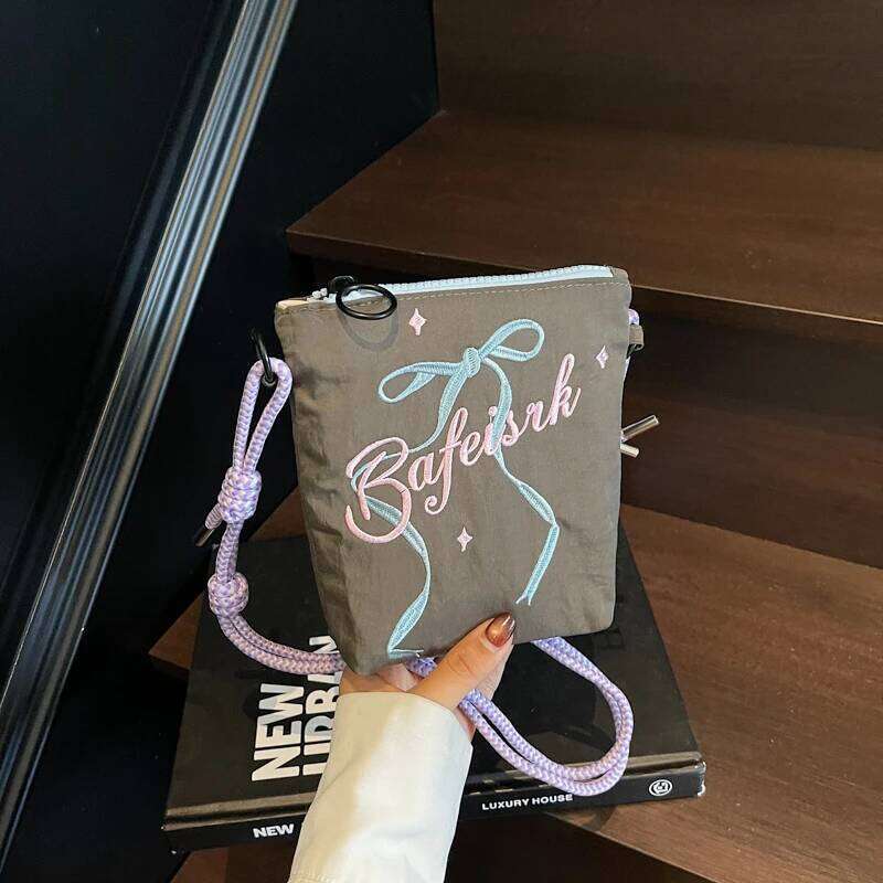 Bow embroidered crossbody bag for women, 2025 new ins niche mobile phone coin purse commuting shoulder bag.