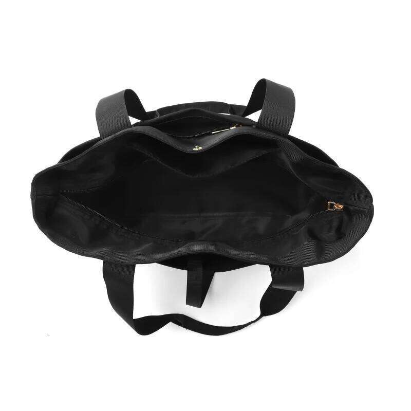 Women's portable folding storage bag with multiple compartments and adjustable shoulder strap for large capacity.