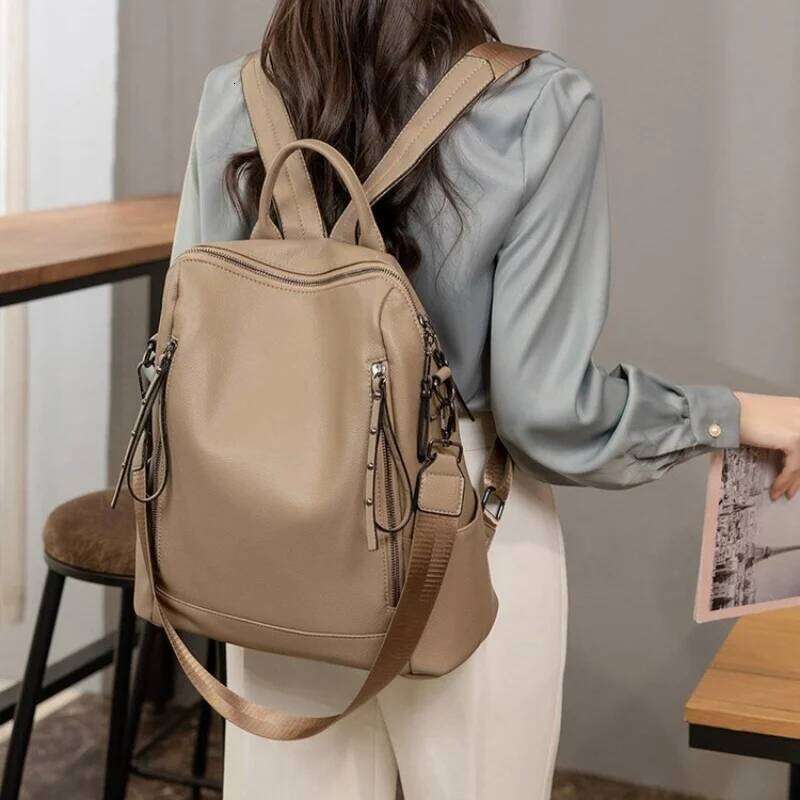 Simple Fashion Backpack Ladies Temperament Hundred Shoulder Soft Leather Solid Color Travel Computer Bag Rivet Decoration