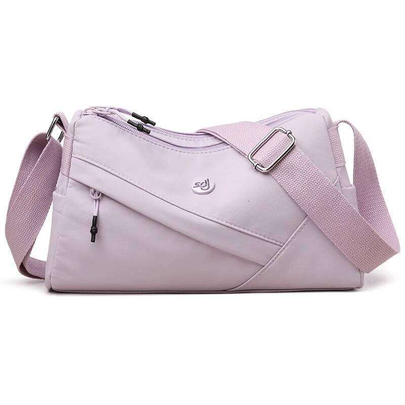 Foreign trade new shoulder lightweight simple fashion portable commuter multi-compartment outdoor crossbody shopping bag