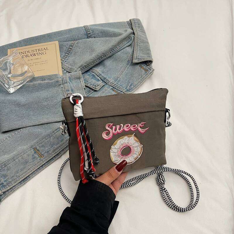 Japanese-style embroidered shoulder bag for women with unique design, large capacity, and a slanted cross-body style, small sq