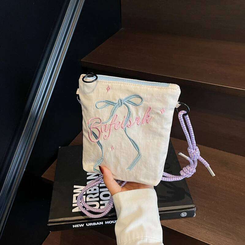 Bow embroidered crossbody bag for women, 2025 new ins niche mobile phone coin purse commuting shoulder bag.