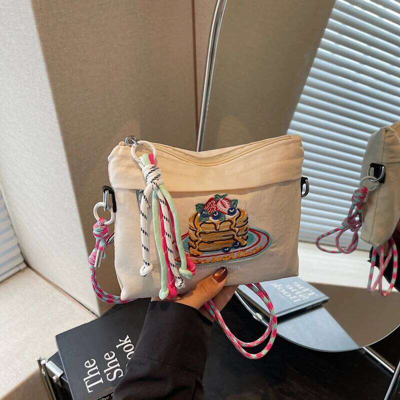 Japanese-style embroidered shoulder bag for women with unique design, large capacity, and a slanted cross-body style, small sq