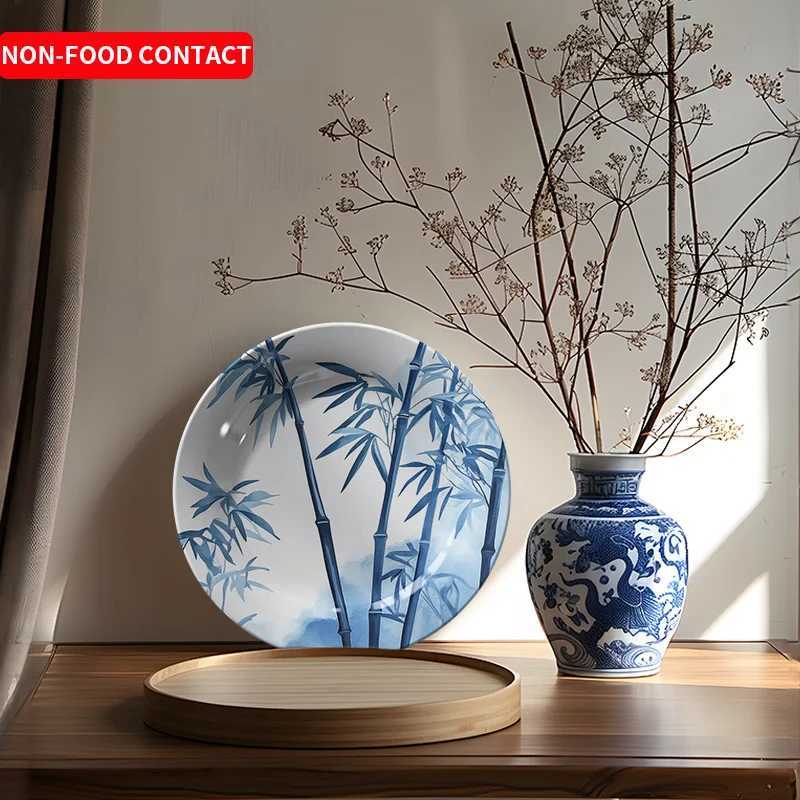 This ink-wash blue and white decorative plate with bamboo motifs brings serenity and elegance to your home decor.T260304