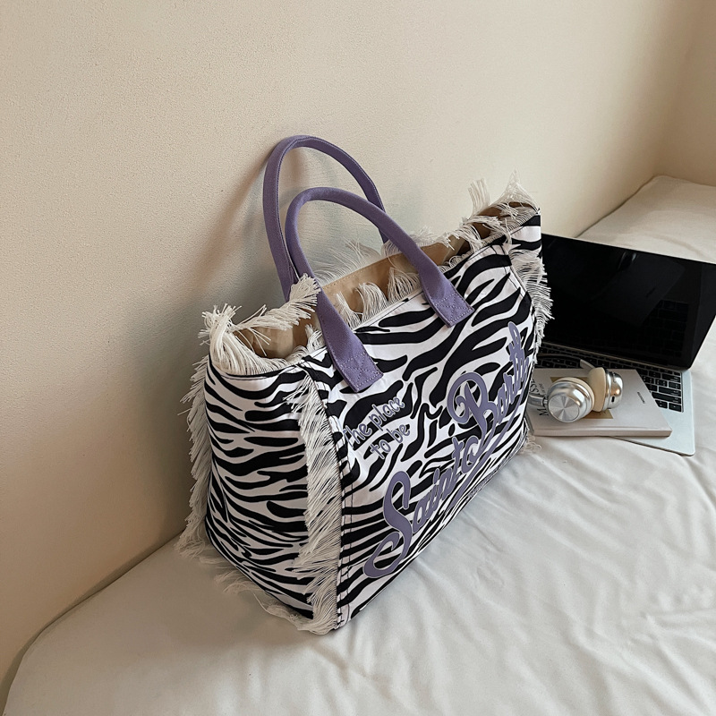 Free shipping bags Tassel letter canvas bag large capacity bag new solid color commuting shoulder tote bag