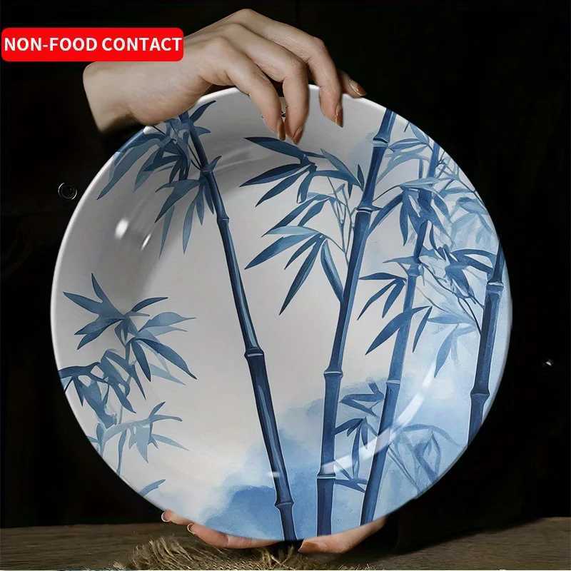 This ink-wash blue and white decorative plate with bamboo motifs brings serenity and elegance to your home decor.T260304