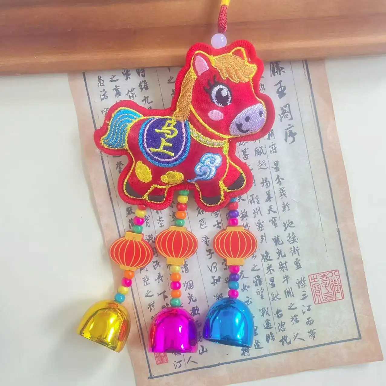 This 2026 Year of the Horse embroidered hanging ornament with tassels brings blessings of immediate success to your home and car.T260304