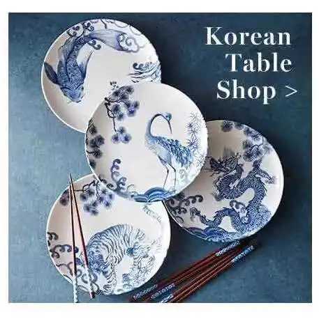 This set of four blue and white porcelain plates with dragon, tiger, and crane motifs brings auspicious charm to your home decor.T260304
