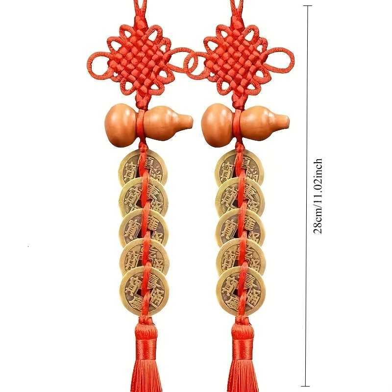 This antique brass Five Emperors Coins pendant with a red tassel symbolizes wealth and protection for your living space.T260304