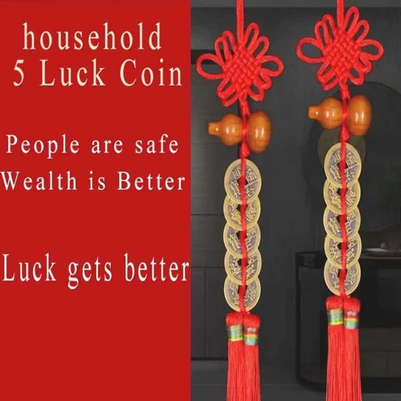 This antique brass Five Emperors Coins pendant with a red tassel symbolizes wealth and protection for your living space.T260304