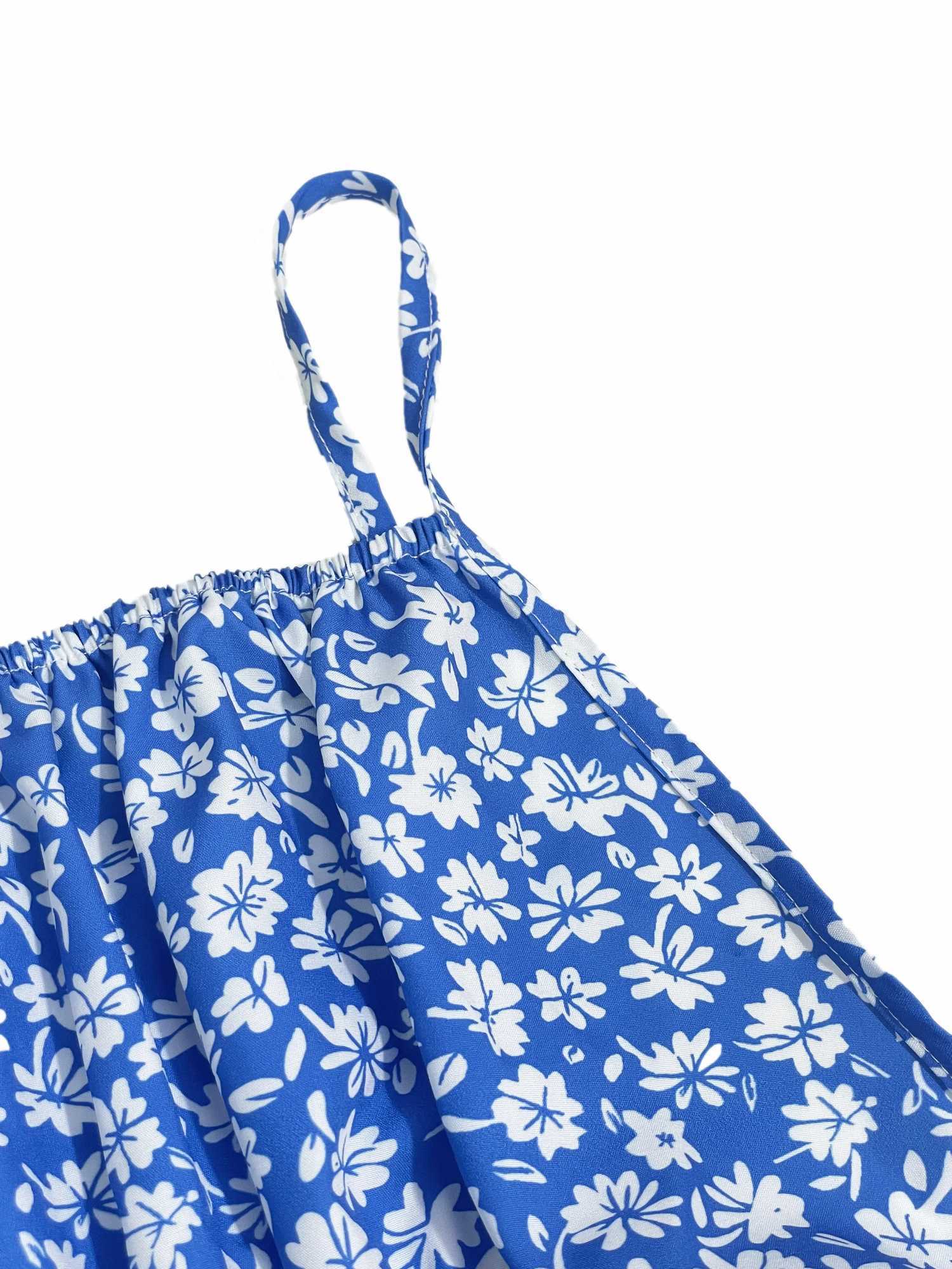 The cami dress with small flower prints a backless design and thin spaghetti straps is suitable for beach vacations and summer M260304