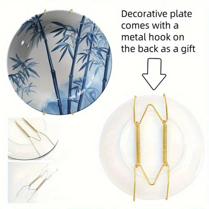 This ink-wash blue and white decorative plate with bamboo motifs brings serenity and elegance to your home decor.T260304