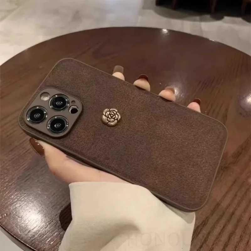 Luxury Suede Leather Metal Camellia Phone Case with Braided Wrist Strap For iPhone 17 Air 16 15 14 Plus 13 Pro Max 12 11 | Premium Skin-Feel Back Cove