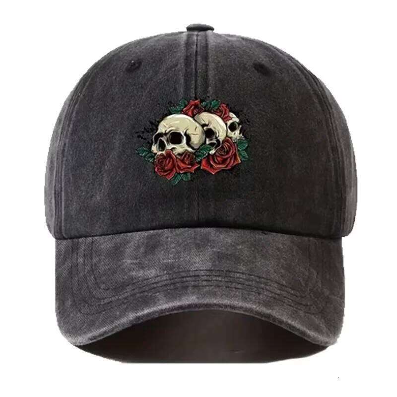 The man's stylish washed-out baseball cap features a hip-hop style skull and rose pattern printed on it. Y260304
