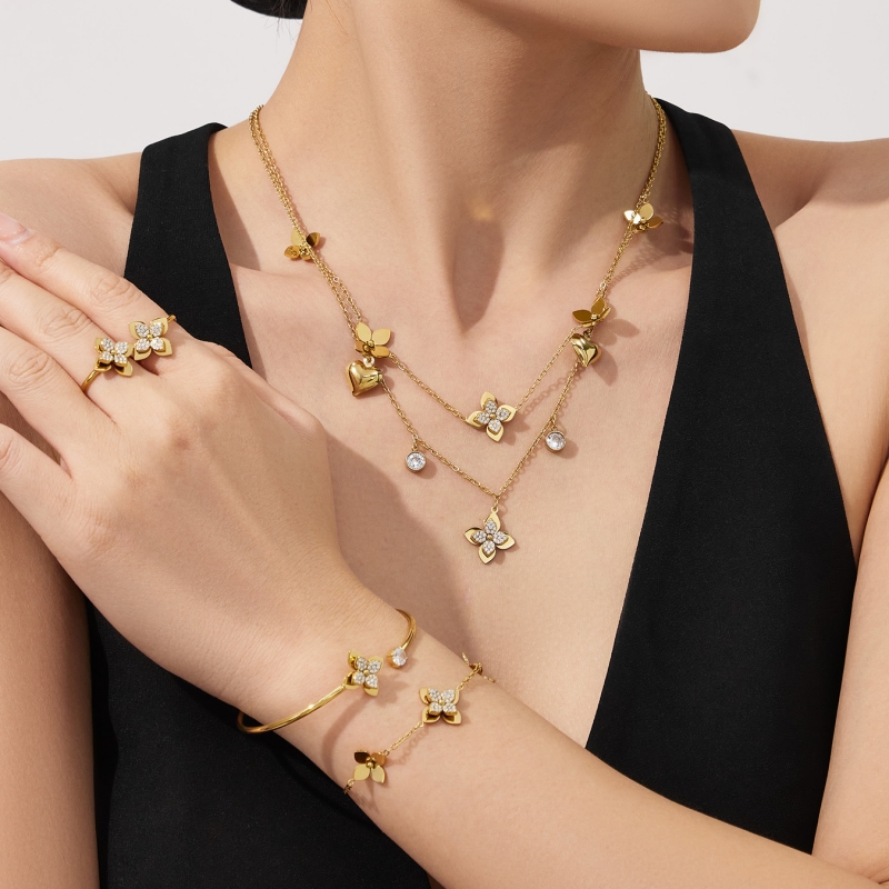 Stainless steel three-dimensional four petal flower earrings bracelet ring necklace jewelry set PVD gold-plated color preservation jewlery designer for women