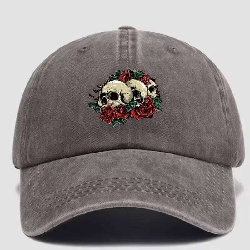 The man's stylish washed-out baseball cap features a hip-hop style skull and rose pattern printed on it. Y260304