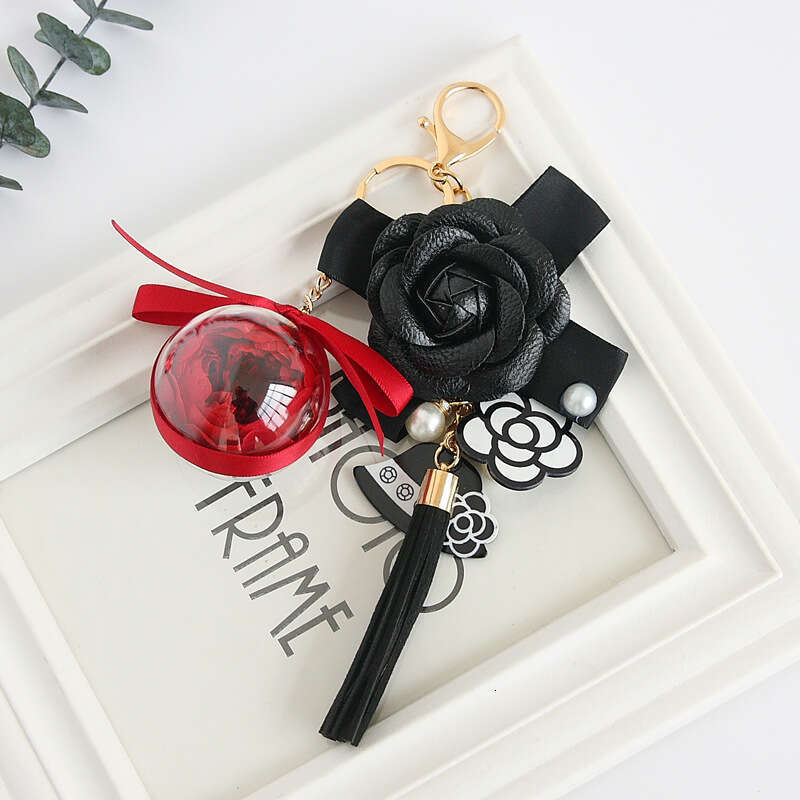 Hepburn-style camellia tassel pearl eternal flower keychain, bag charm, exquisite handmade floral gift