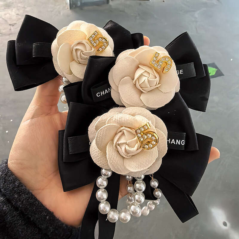 2025 New Camellia Bowknot Fashion Versatile Bow Tie Flower Pearl Brooch