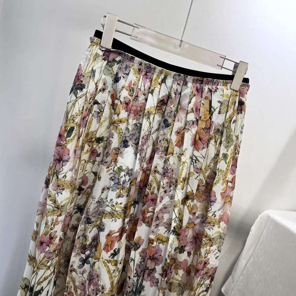 The 2026 Spring and Summer A4 New Collection features a colorful floral cotton chiffon pleated skirt for women