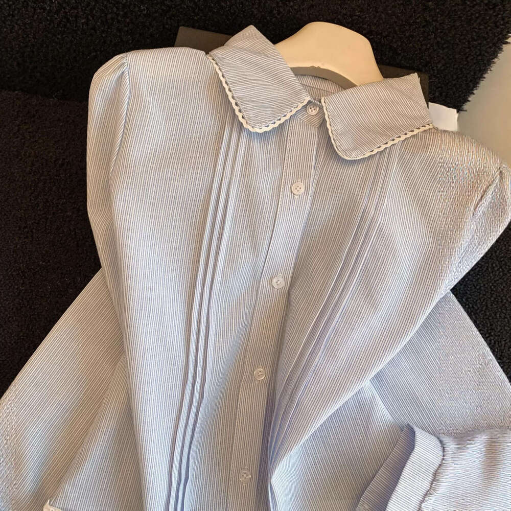 Elegant white long-sleeve shirt with lace hem and patchwork design for women, 2026 new model, Designer doll collar top A10479