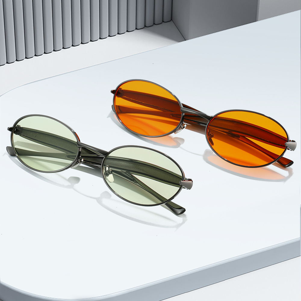 New European American oval small-frame sunglasses for men women, featuring high-end, fashionable, and unique design with a metallic trendy look