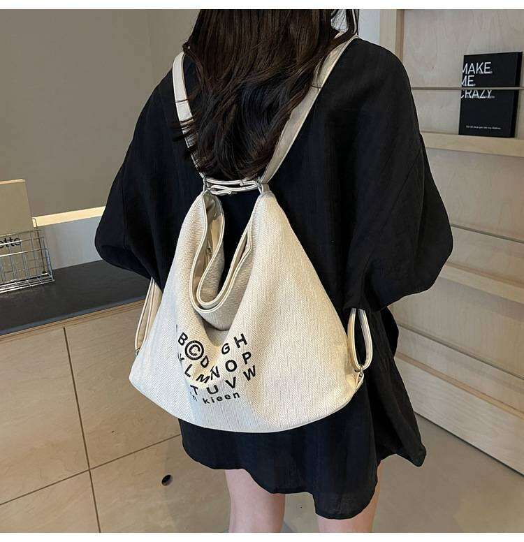 Korean Style Casual Letter Printed Large Capacity Canvas Bag New Unique Tote With Minimalist That Can Also Be Used As A Backpack XIU LAI SI