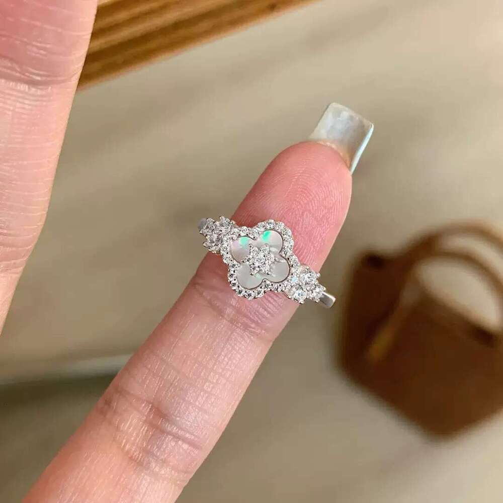 Elegant Pink Floral Design Charm Bangle: Four-Leaved Lucky Charms Accented by Tiny Sparkling Cubic Zirconia Stones for Women's Jewelry Collection