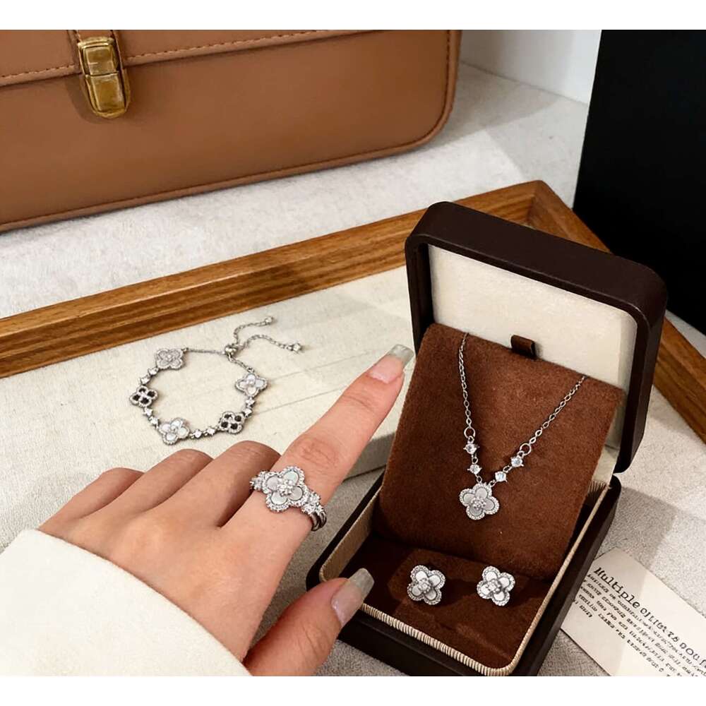 Elegant Pink Floral Design Charm Bangle: Four-Leaved Lucky Charms Accented by Tiny Sparkling Cubic Zirconia Stones for Women's Jewelry Collection