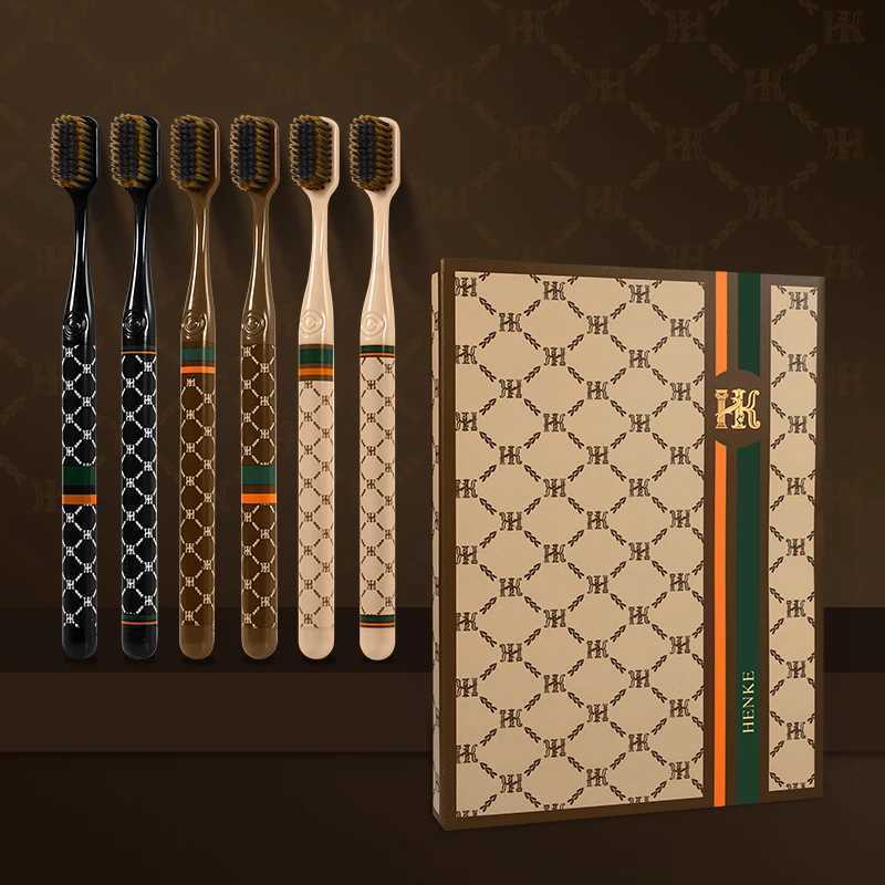 This 6-pack of adult toothbrushes features soft bristles, a small head, and a luxury plaid handle, making it an ideal family gift box set.T260306