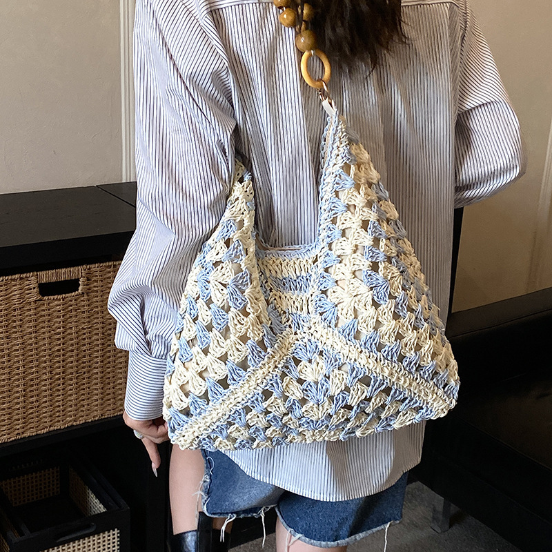 Beach vacation straw bag women's new multifunctional commuting shoulder bag art niche handbag crossbody bag designer bag