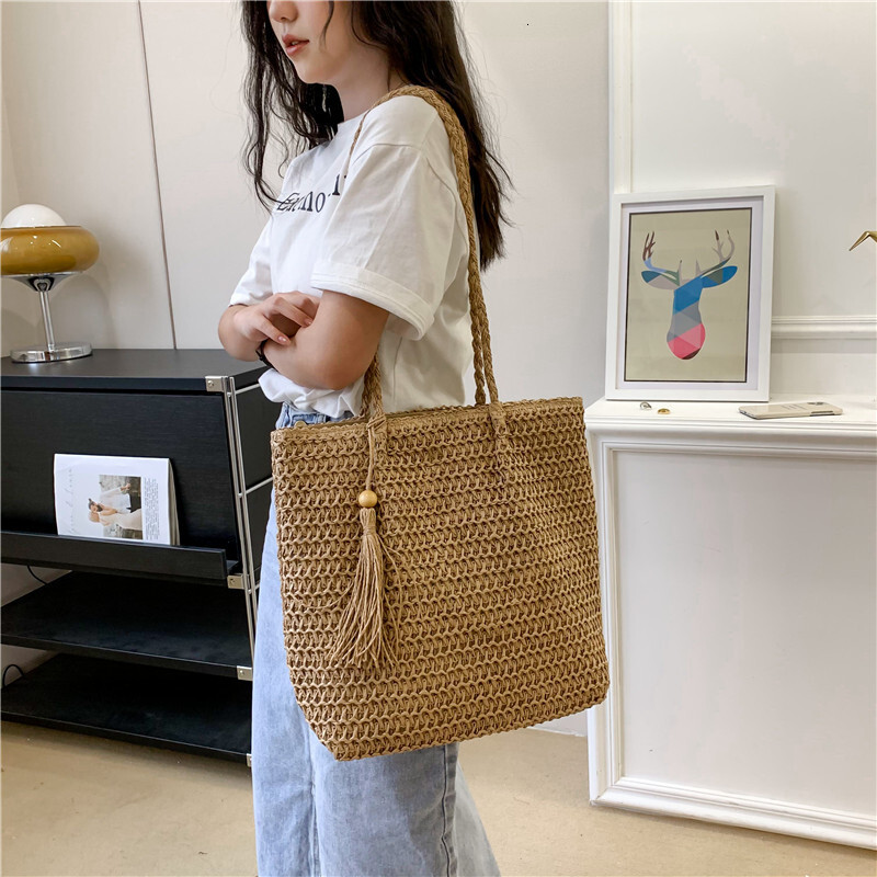 Beach vacation style women's large bag new hollow straw tote bag spring and summer large capacity armpit beach bag designer bag