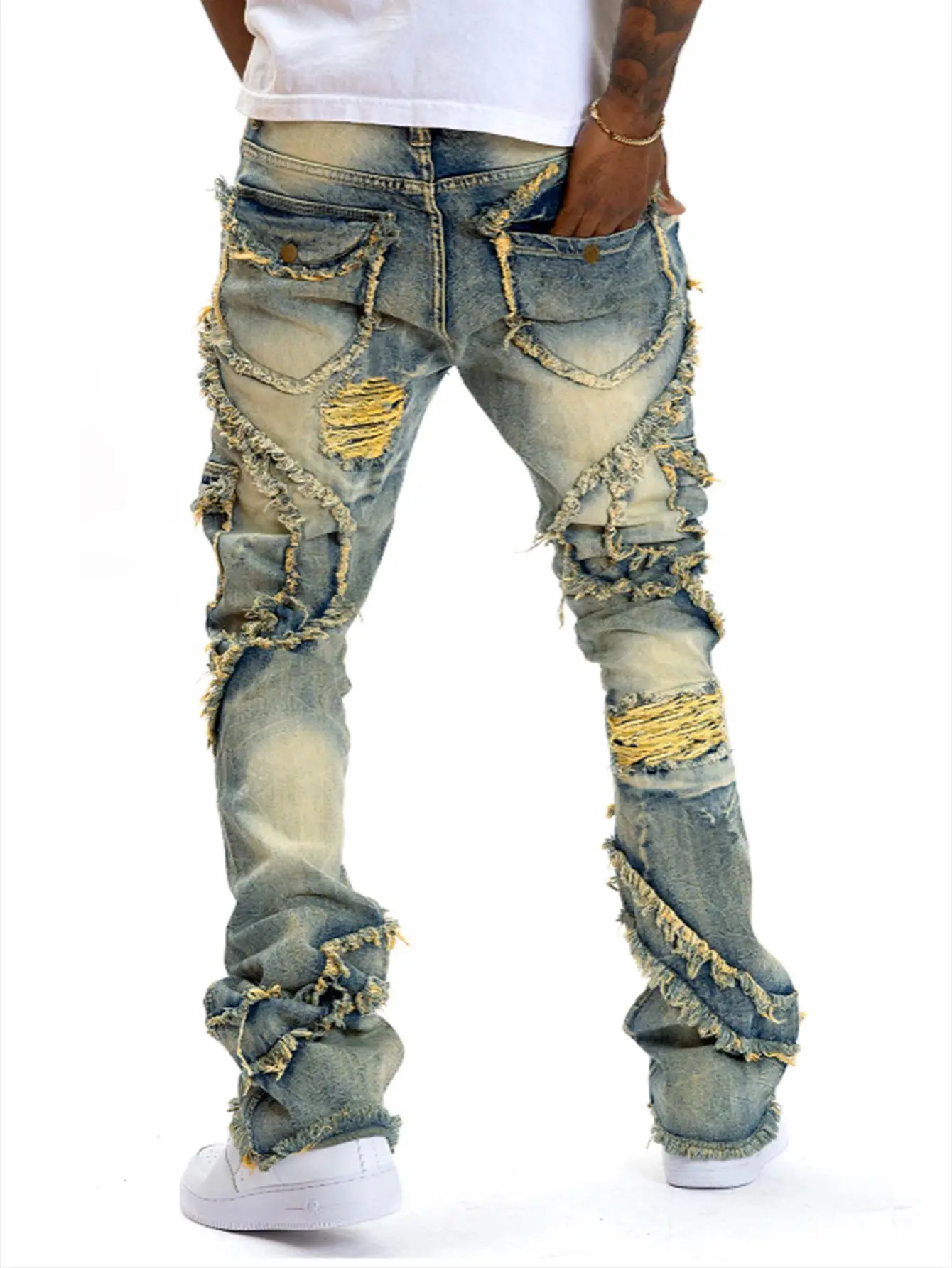 2025 European and American mens casual jeans street punk fashion retro ripped hole slightly flared tassel elastic 260228